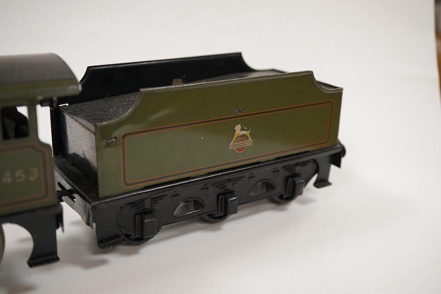 An 0 gauge Bassett-Lowke clockwork tinplate BR 4-4-0 tender locomotive, Prince Charles 62453, in dark green livery with orange and black lining and original clockwork mechanism